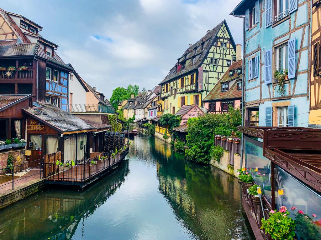 Colourful houses line the quiet canal in Colmar